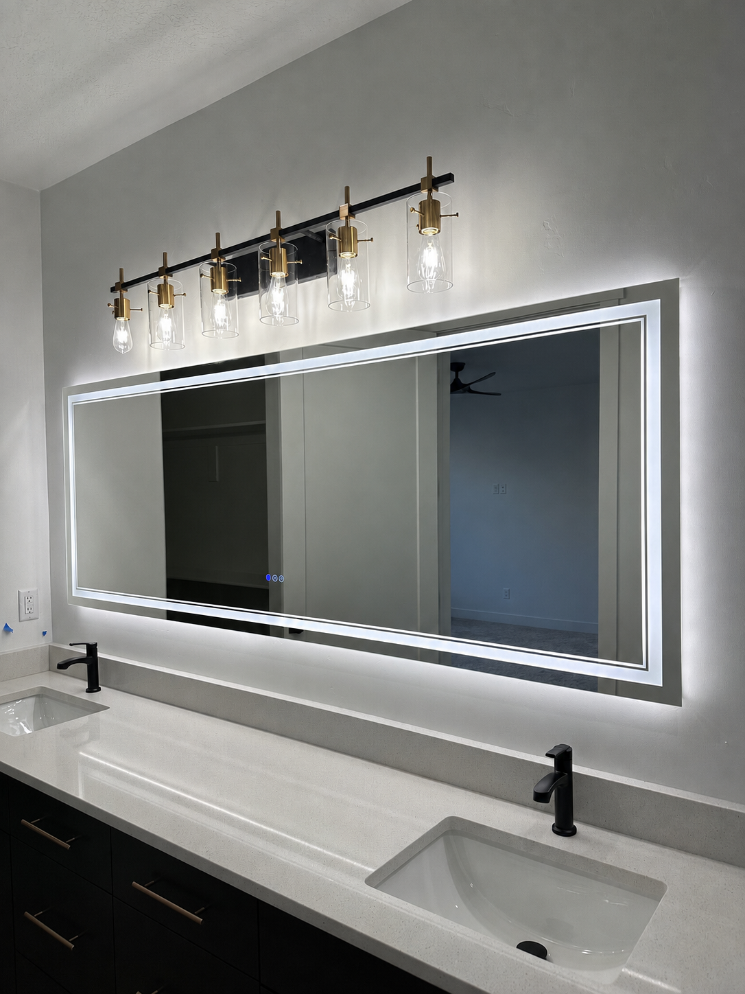 Modern bathroom vanity lighting installation by Simple Electric